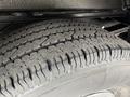 Close-up of a tire from a 2013 Chevrolet Express showing detailed tread patterns and rubber texture
