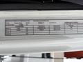 A label detailing specifications of a 2012 International 7400 including weight, tire size, and rim dimensions