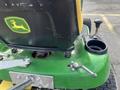 2021 John Deere L Series S lawn mower featuring a green body with a yellow seat and logo levers for operation and a cup holder