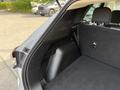 Interior of a 2020 Ford Escape showing the cargo area with a flat floor and black fabric upholstery