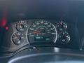 Dashboard of a 2015 GMC Savana featuring speedometer fuel gauge temperature gauge and warning lights