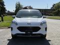 A 2020 Ford Escape facing forward with a white exterior and a distinctive front grille design