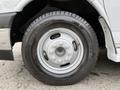 Close-up of a wheel from a 2020 Chevrolet Express featuring a silver rim and a black tire with visible tread patterns