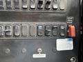 Control panel with multiple switches including lights wipers and a cab pressurizer switch on a 2012 International DuraStar 4300