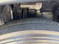 Close-up view of a tire tread on a 2016 Isuzu NPR-HD showing detailed grooves and texture