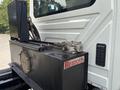 A hydraulic tank with a label reading Rexroth attached to the side of a 2013 International WorkStar truck