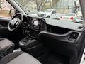 Interior view of a 2017 RAM ProMaster City featuring a dashboard with digital display controls and a gear shift in the center console