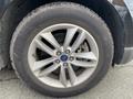 Close-up of a 2017 Ford Edge wheel featuring a silver alloy rim and a Goodyear tire with visible tread pattern and branding