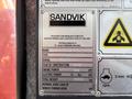 A metal identification plate displaying details about a 2018 Sandvik Ranger DX800 including type serial number year of construction engine power electric power and total weight