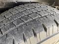 Close-up of a worn tire from a 2011 Ford Econoline showcasing the tread pattern and surface texture