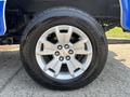 A 2017 Chevrolet Colorado tire with a silver alloy wheel featuring five spokes and the Chevrolet logo in the center mounted on a black rubber tire with the brand name visible
