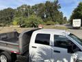 A 2013 RAM 5500 truck with a flatbed and a yellow light on the roof