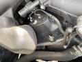 A close-up of the engine compartment of a 2019 Ford Transit showing various components including connectors and wiring near the engine block