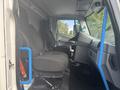 Interior view of a 2020 Lion Lion6 showing two black seats and a dashboard with a steering wheel and control panel