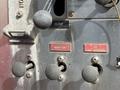 Close and monitor control levers with labeled buttons and discharge valves on a 1992 Emergency One Typhoon Superior fire truck