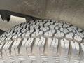 Close-up of a tire from a 2024 Mercedes-Benz Sprinter showing distinct tread patterns and grooves