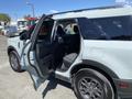 A 2023 Ford Bronco Sport with an open driver's door showcasing the interior including seats and dashboard