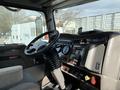 Interior of a 2008 Kenworth T370 showing the steering wheel dashboard gauges and control panel