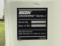 A label on a white vehicle displaying the Elgin Crosswind Series J details including serial number and manufacturing date