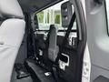 Interior of a 2013 Ford F-250 SD showing the back seat area with seatbelts and mounting brackets visible