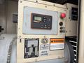 A 2005 Katolight SED60FPJ4 generator with a control panel featuring a display screen and buttons for operation and warning labels