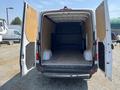 2022 Mercedes-Benz Sprinter van with open rear doors showing a spacious empty cargo area and wooden interior walls