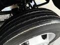 Close-up of a worn tire on a 2008 Sterling Bullet showing visible tread wear and sidewall scuffing
