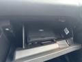 A 2018 Ford Focus glove compartment with a black pouch labeled Ford visible inside