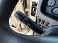 A close-up of the turn signal lever in a 2015 Peterbilt 337 with controls for headlights wipers and turn signals visible