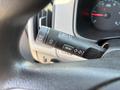 Close-up of the turn signal and menu control lever inside a 2017 Chevrolet Colorado