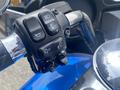 Close-up of the controls on a 2017 Harley-Davidson FLHTKL motorcycle showing various buttons for lights indicators and cruise control
