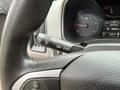 A close-up view of a 2017 Chevrolet Colorado steering wheel with controls for menu navigation and cruise settings visible on the left side
