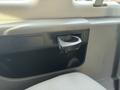 A cup holder attached to the dashboard of a 2013 Ford E-350 Super Duty
