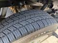 Close-up of a treaded tire from a 2014 Ford F-150 showcasing its detailed pattern and rubber composition