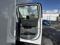 Open door of a 2024 Ford F-550 showing the interior door handle and armrest area