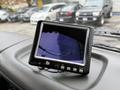 A monitor displaying a camera feed installed in the dashboard of a 2009 UD Trucks UD 3300