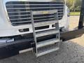 A 2022 Freightliner M2 106 with a metal step ladder attached to the front grille