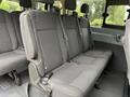 2017 Ford Transit T150 XLT interior featuring gray fabric seats in a spacious arrangement with safety seatbelts visible on each seat