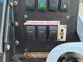 Close-up view of the control panel of a 2008 Workhorse W62 featuring multiple switches and lights including a horn alert and strobe flashers