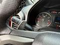 Close-up of the steering wheel and dashboard of a 2019 Ford F-150 showing the speedometer and an indicator lever