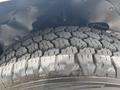 Close-up of a rugged tire with deep tread patterns from a 2020 Chevrolet Express showcasing its substantial grip and durability