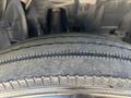 Close-up of a tire on a 2022 Isuzu NRR showing tread patterns and sidewall details