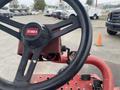Close-up of the steering wheel and control panel of a 2011 Toro Reelmaster 3100-D lawn mower