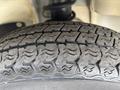 Close-up of a textured tire tread from a 2010 Daihatsu Hijet showcasing its grooves and patterns designed for traction