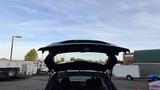 A 2019 Nissan Kicks with its rear hatch open showcasing the cargo area and interior design elements
