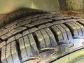 Close-up of a tire from a 2020 Chevrolet Express showing detailed tread pattern and surface wear