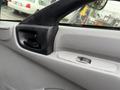 Interior door handle and window controls of a 2015 Hino 195 truck