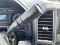 Close-up of the tow/haul switch on the steering column of a 2017 Ford F-250 SD