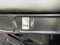Close-up of a seat adjustment lever in a 2014 International TerraStar showing a pull mechanism for tilting the seat backrest