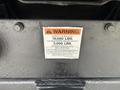 A warning label on a 2014 Ford F-550 displays capacity information for the hitch including 16000 lbs maximum trailer weight and 3000 lbs maximum vertical load